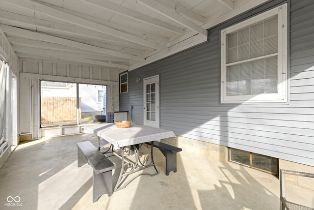 sunroom with beam ceiling