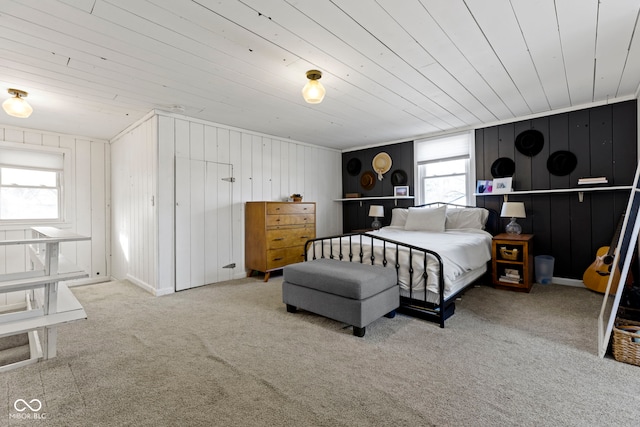 carpeted bedroom with multiple windows and wooden ceiling