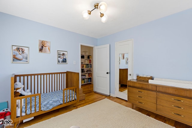 bedroom with light hardwood / wood-style flooring