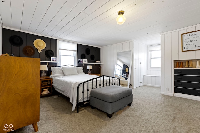 carpeted bedroom featuring wood ceiling