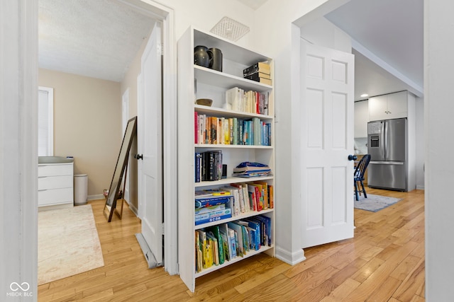 hall featuring light wood-type flooring