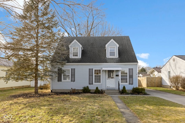 cape cod-style house featuring a front yard