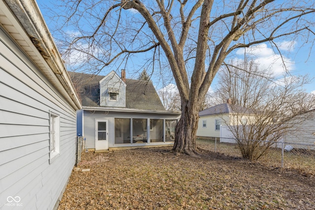 rear view of house with a sunroom