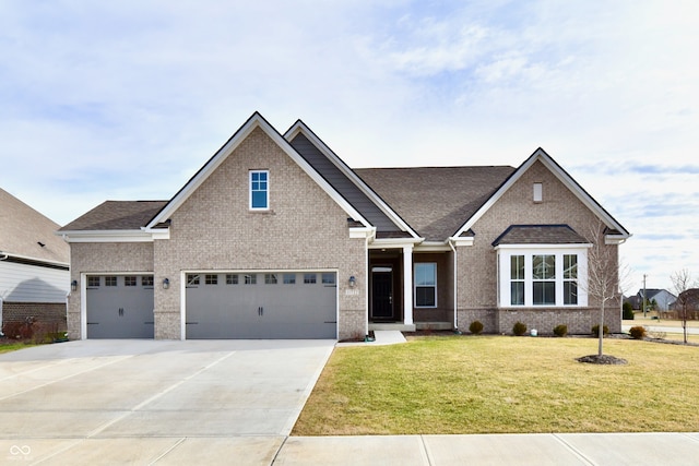 view of front of property featuring a garage and a front lawn