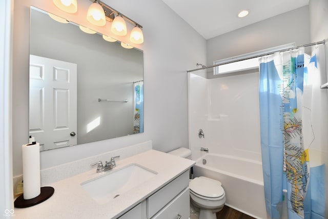 full bathroom with vanity, toilet, and shower / bath combo with shower curtain