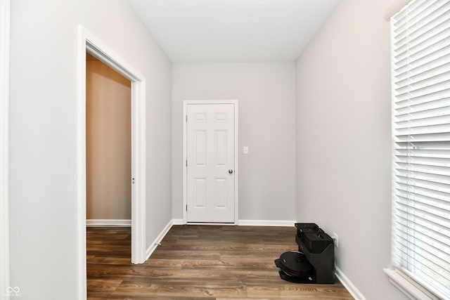 hall with dark hardwood / wood-style floors