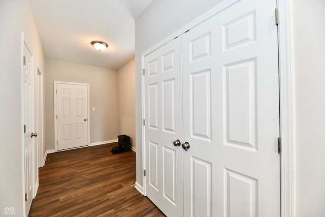 corridor with dark hardwood / wood-style floors