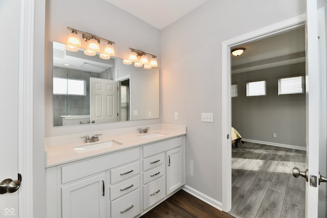 bathroom with vanity and hardwood / wood-style flooring