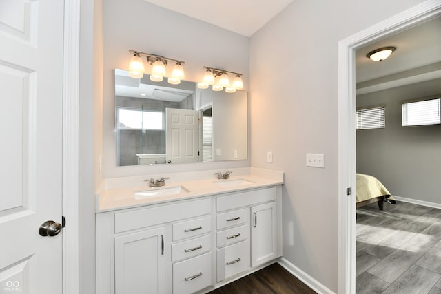 bathroom featuring vanity and hardwood / wood-style floors