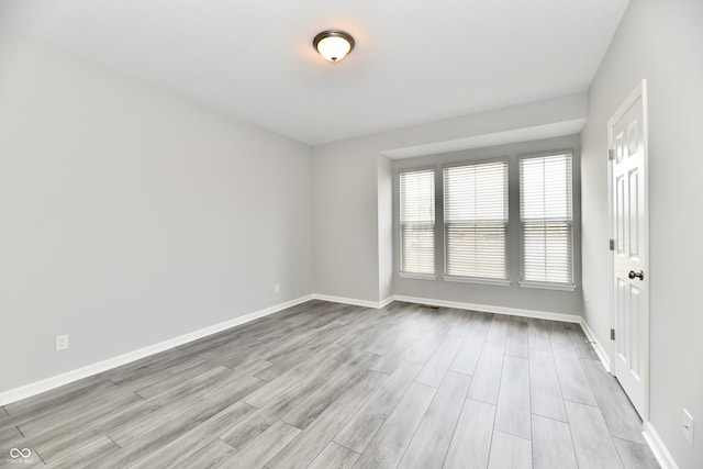 unfurnished room featuring light wood-type flooring