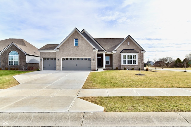 craftsman house with a garage and a front lawn