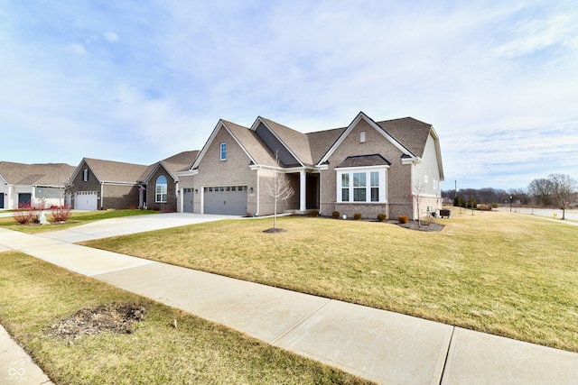 view of front of property with a garage and a front yard