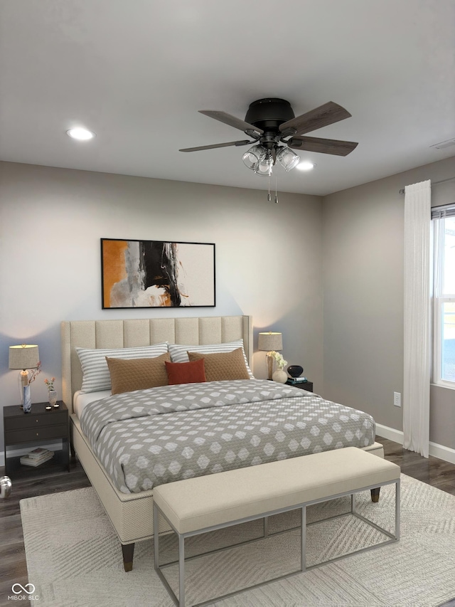 bedroom featuring dark wood-type flooring and ceiling fan