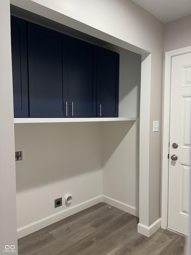 clothes washing area with dark hardwood / wood-style flooring, hookup for a washing machine, and electric dryer hookup