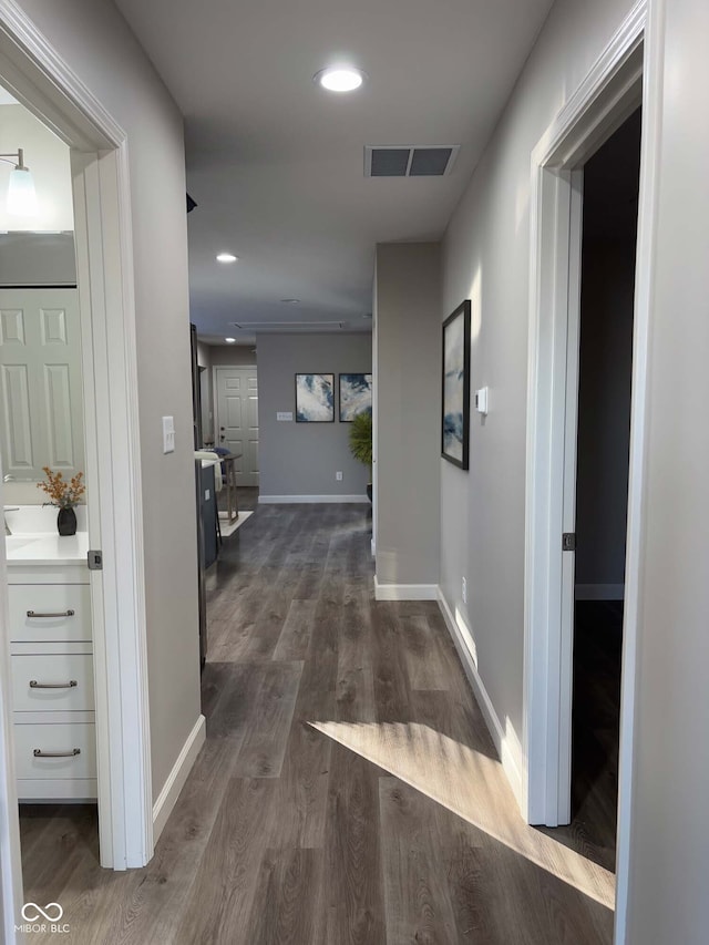 hall with dark hardwood / wood-style flooring