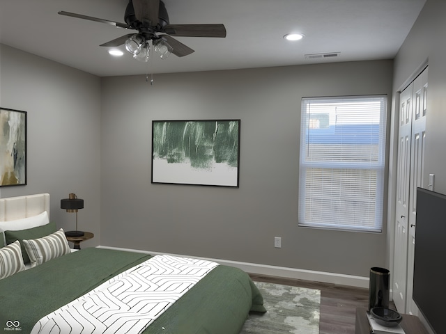 bedroom with hardwood / wood-style flooring and ceiling fan