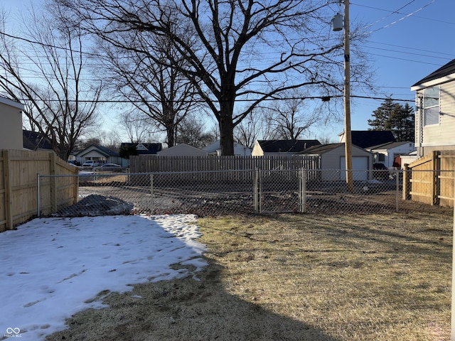 view of yard covered in snow