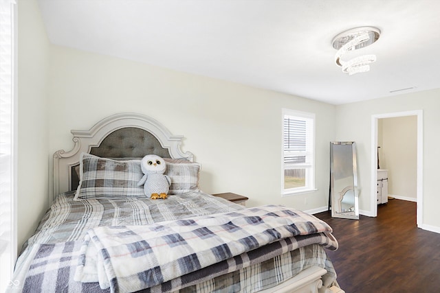 bedroom featuring dark wood-type flooring