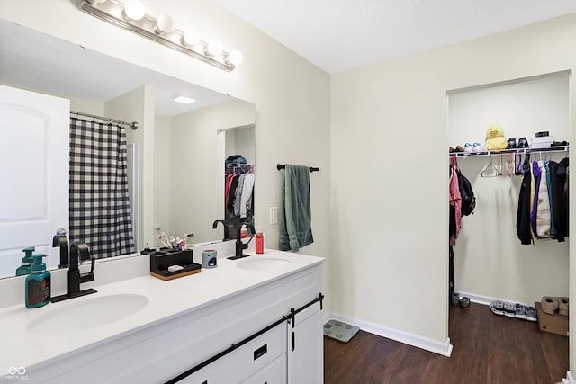 bathroom featuring vanity and hardwood / wood-style floors