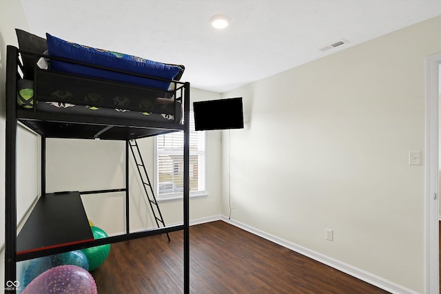 unfurnished bedroom featuring dark hardwood / wood-style floors