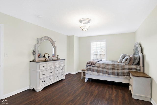 bedroom featuring dark hardwood / wood-style flooring