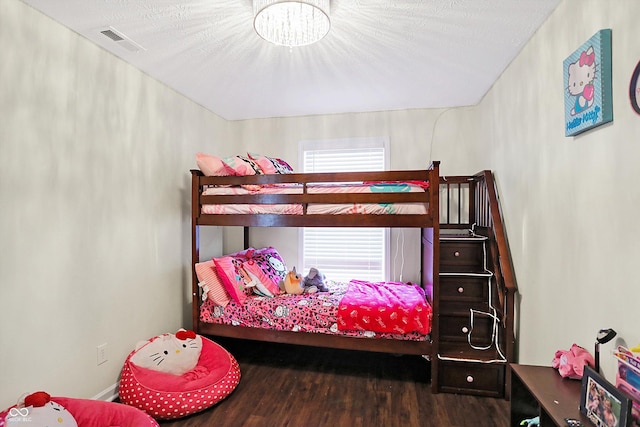 bedroom with wood-type flooring