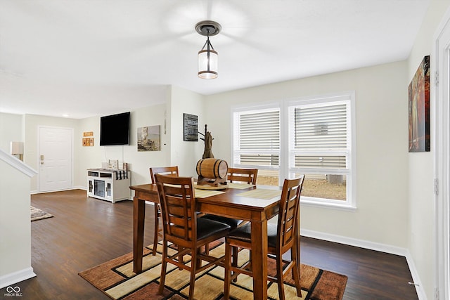 dining space featuring dark hardwood / wood-style floors