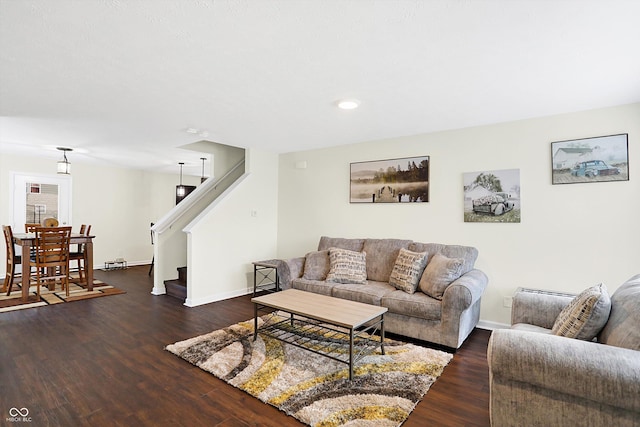 living room with dark hardwood / wood-style floors