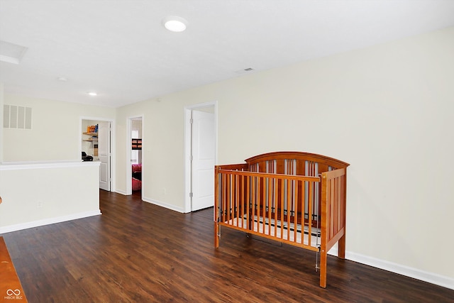 bedroom featuring dark wood-type flooring