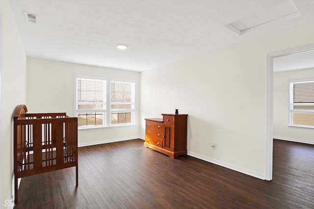 bedroom with dark wood-type flooring