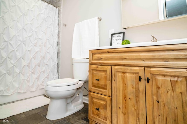 full bathroom featuring vanity, shower / bath combination with curtain, and toilet