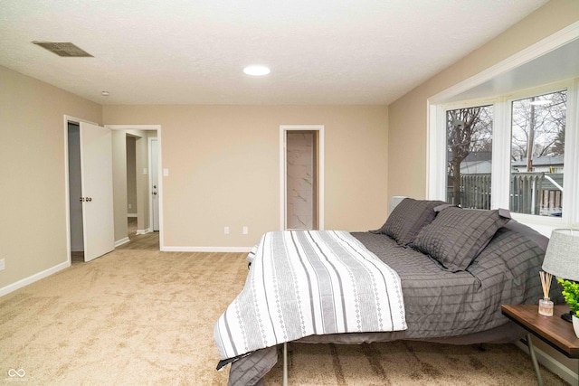 carpeted bedroom with a textured ceiling