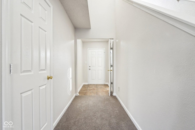 corridor with light carpet