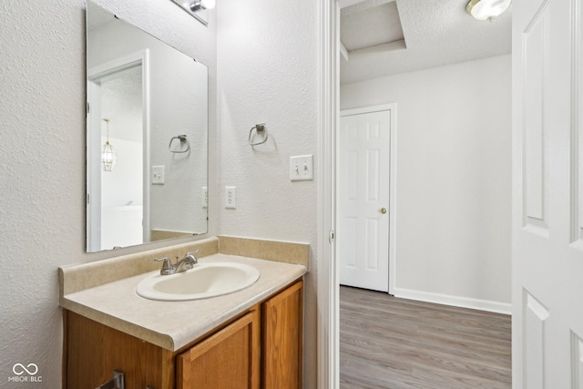 bathroom featuring vanity and wood-type flooring