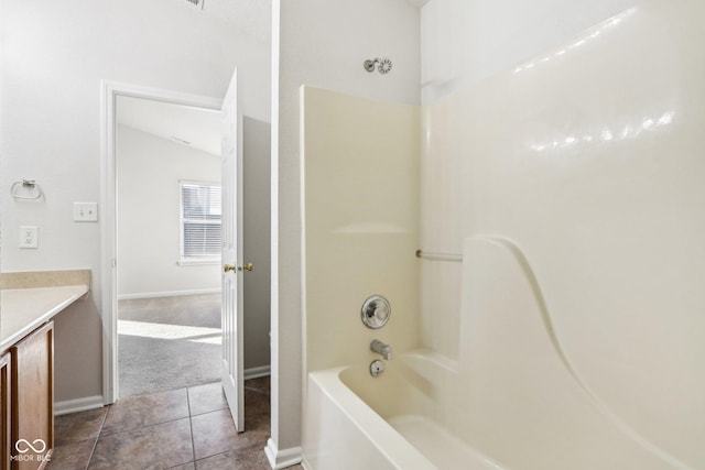 bathroom with shower / bathtub combination, vanity, and tile patterned floors