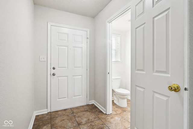 interior space with a textured ceiling