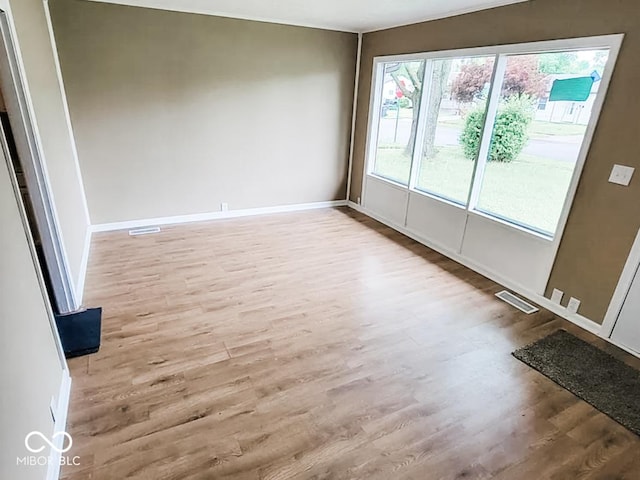 unfurnished room featuring light hardwood / wood-style floors