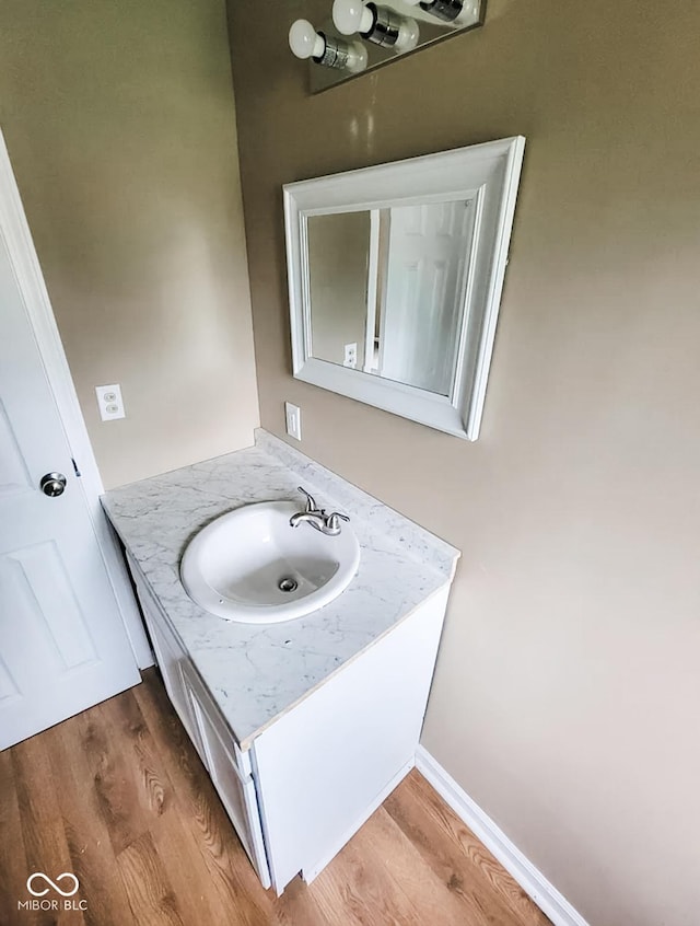 bathroom featuring vanity and hardwood / wood-style floors