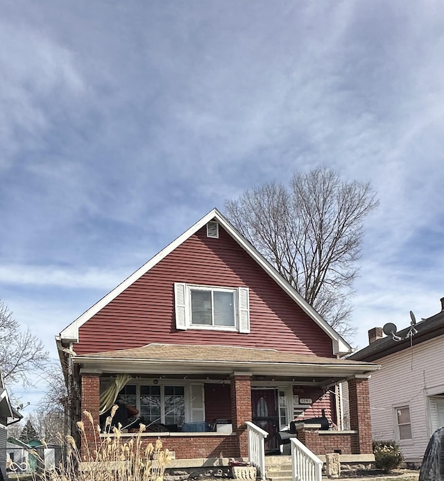1341 N Dearborn St, Indianapolis, IN 46201 - view of front of property featuring covered porch