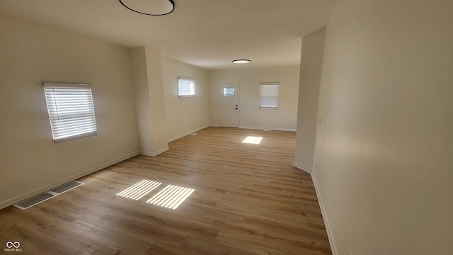 unfurnished room featuring light hardwood / wood-style floors