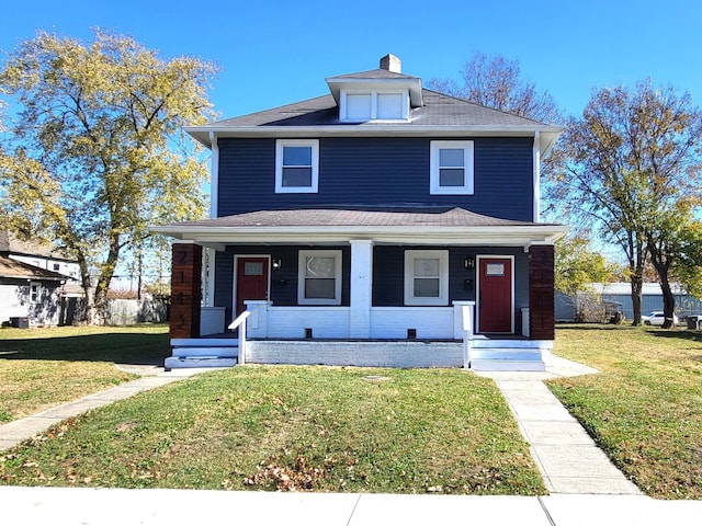 view of front of home featuring covered porch and a front lawn