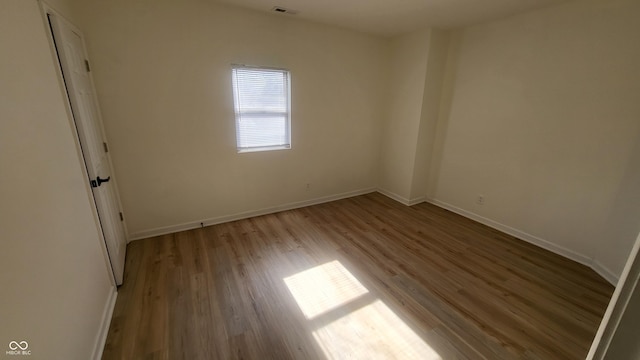 spare room with light hardwood / wood-style floors