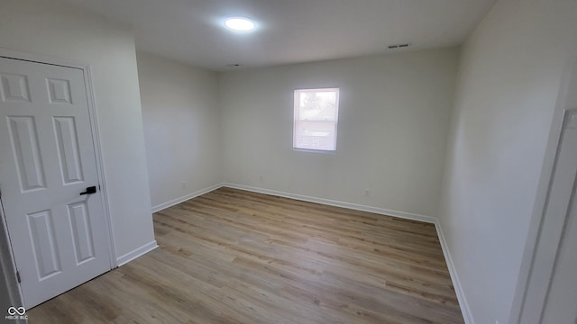 spare room with light wood-type flooring