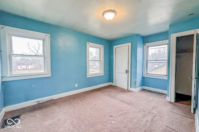 unfurnished bedroom with light carpet