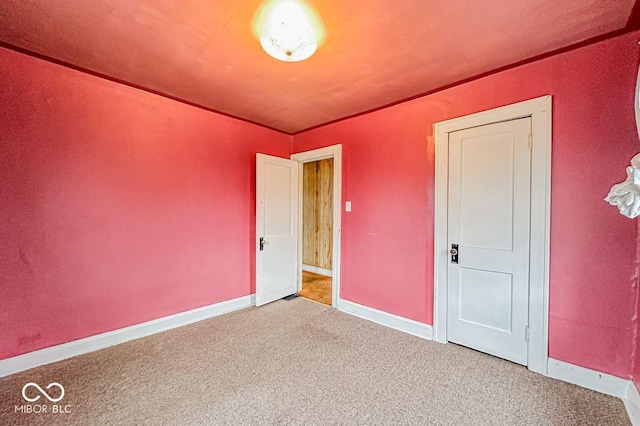 unfurnished bedroom featuring carpet