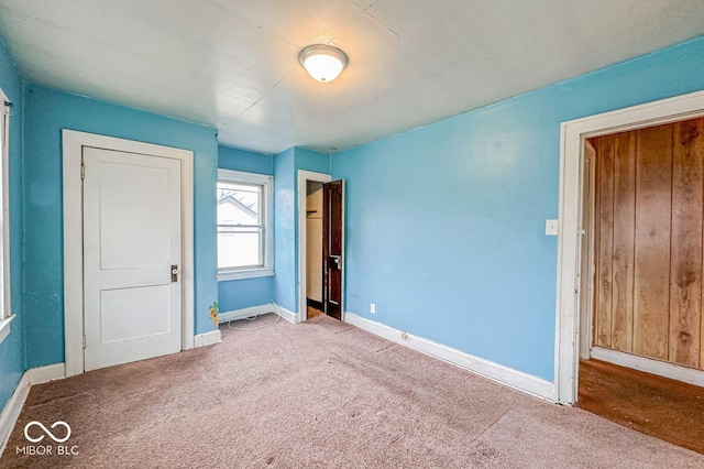 unfurnished bedroom with carpet