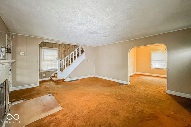 unfurnished living room featuring a textured ceiling