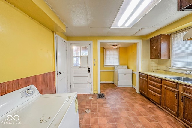 laundry area featuring washer / clothes dryer and sink