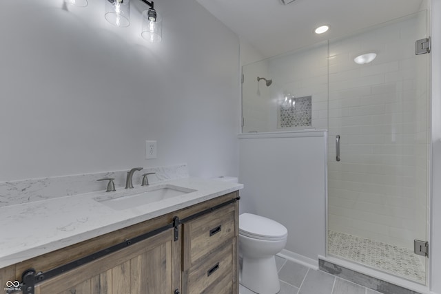 bathroom featuring vanity, walk in shower, tile patterned floors, and toilet