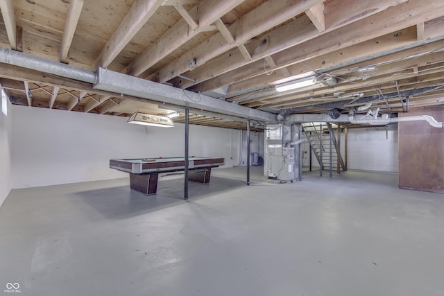 basement with heating unit and pool table